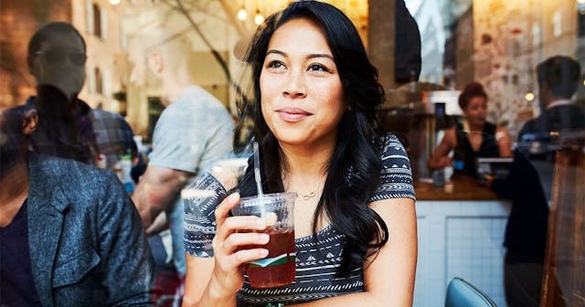 I Learned My Self-Care Love Languages And It's Fascinating: woman thinking in cafe window