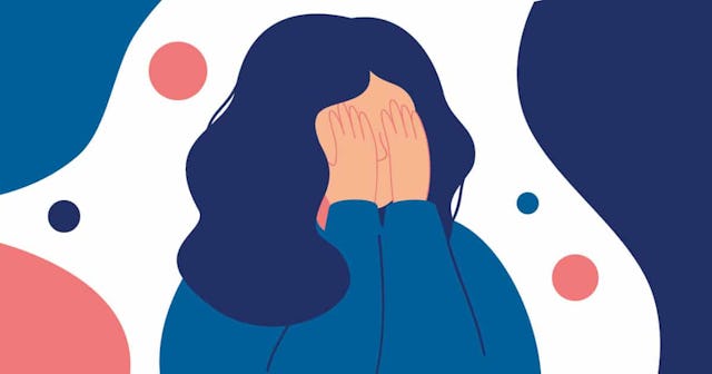 woman crying covering her face with her hands