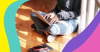 woman sitting floor on computer