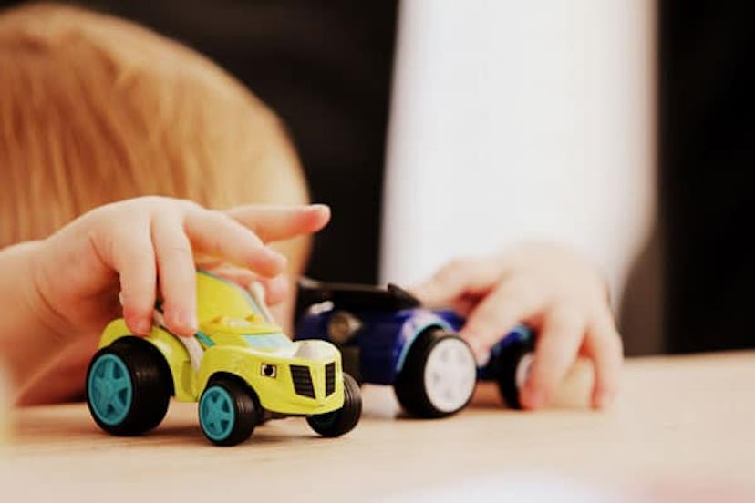 boy playing with trucks