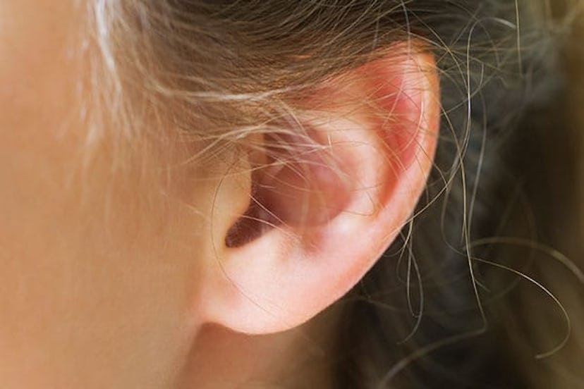 Close-up of young woman's pierced ear