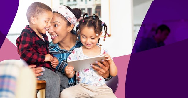 Mother, son and daughter having fun with tablet