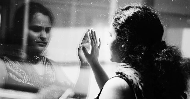 Woman hand on window
