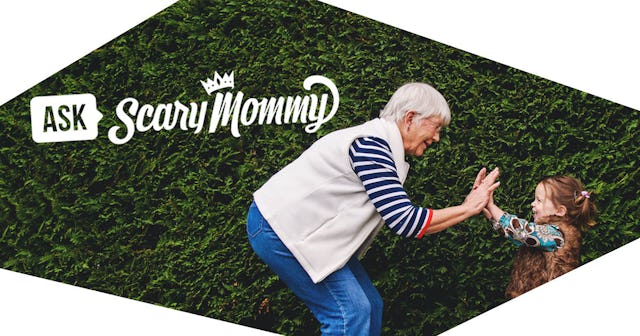 Girl playing pat-a-cake with her grandmother