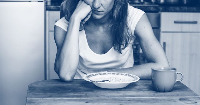 woman in her kitchen not eating
