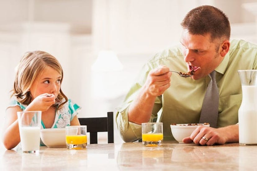 father and daughter eating together