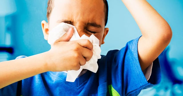 boy blowing his nose