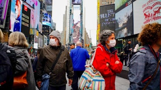 People wear face masks in Times Square New York
