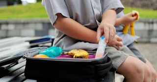food allergies in kids, child taking out epipen from lunchbox