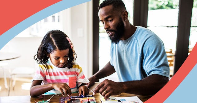 father and daughter working on science project at home
