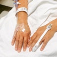 Sam Kuhr's hands with infusion units