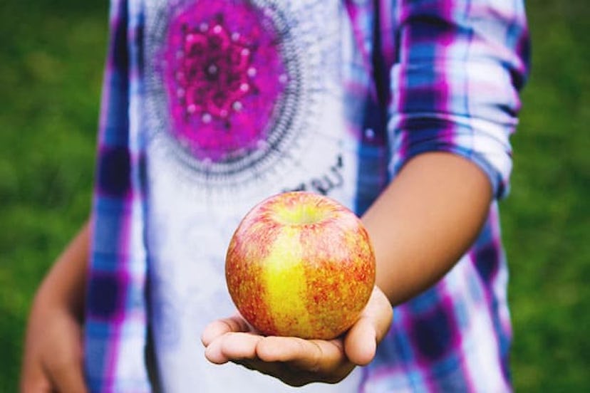 child holding apple
