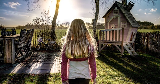 A Male Teacher Told My Daughter Her Hair Was 'Sexy': young girl standing in yard