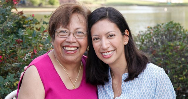 Mother and daughter posing for photo