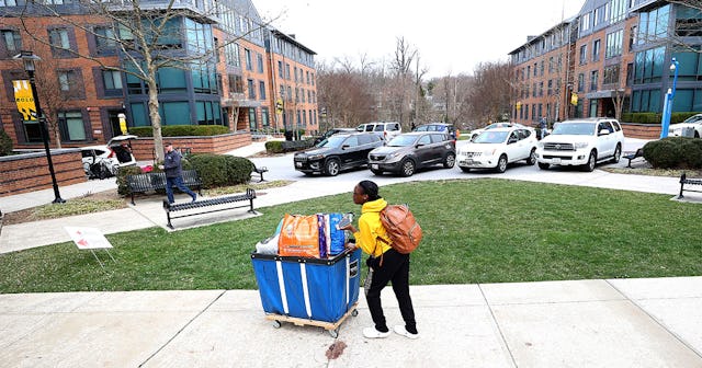 Towson University students remove their belongings out of the dorms as the school shut down days bef...