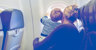 mother and baby looking out airplane window