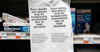 signs for sold out facemasks are posted in a Manhattan pharmacy