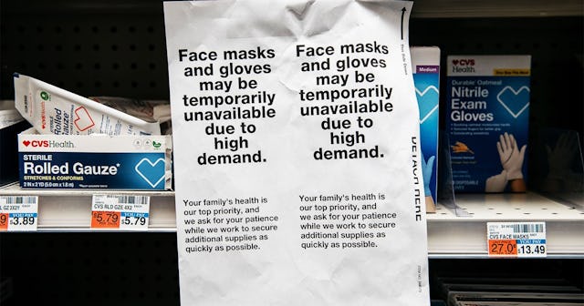 signs for sold out facemasks are posted in a Manhattan pharmacy