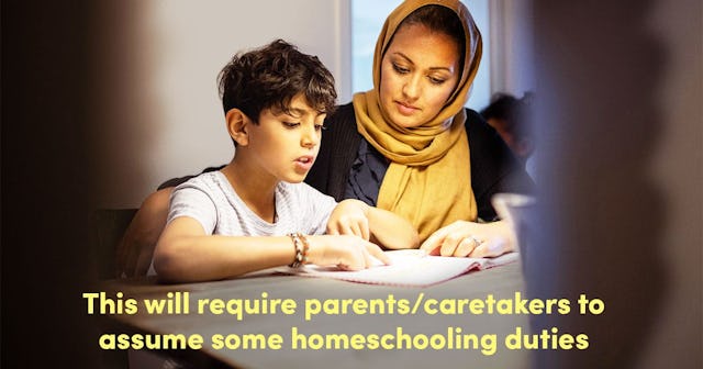 Mother and son reading book at home