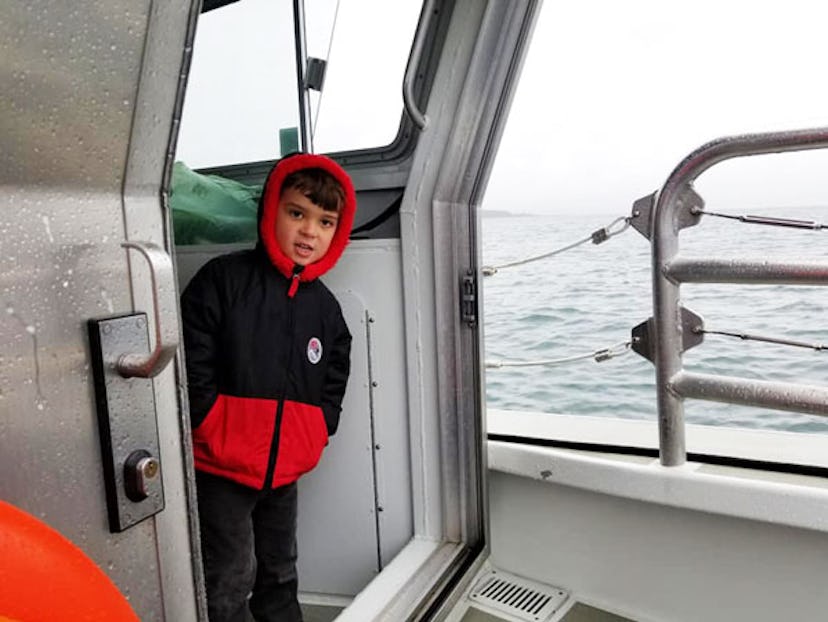 What Our Family Learned By Traveling With Friends Who Do Not Have Kids: little boy on boat