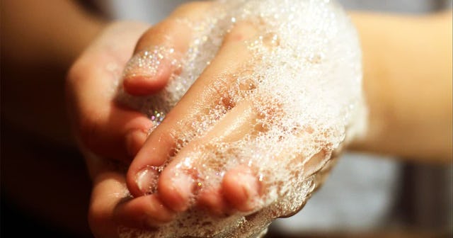 Woman washing her hands