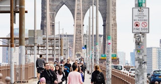 People flock to Brooklyn Bridge despite government orders to socially distance and stay at home in N...