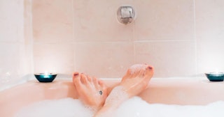 Woman's feet in bubble bath