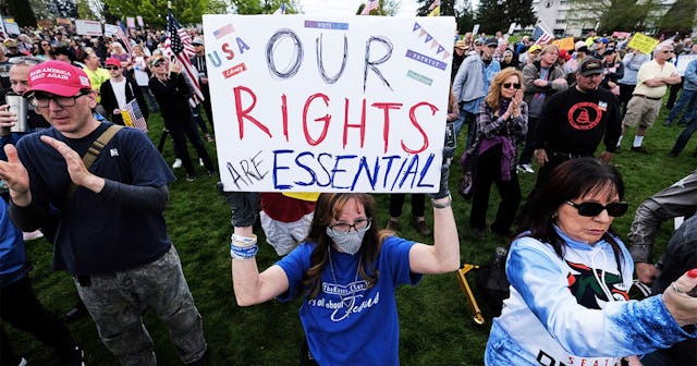 Hundreds of protesters demonstrate outside the state Capitol to speak out against against Governor I...