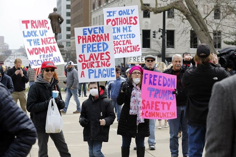 People protest against excessive quarantine amid the coronavirus pandemic at the Michigan State Capi...