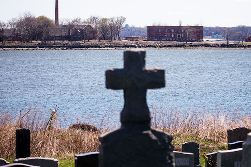 A large burial pit and abandoned buildings are seen on Hart Island where some of the COVID-19 victim...