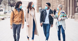 Group of friends walking together during virus epidemic