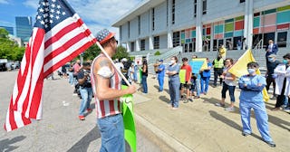 Protesters from a grassroots organization called REOPEN NC gather for pressure North Carolina Govern...