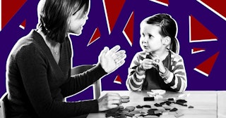 Preschool girl listening to teacher in classroom