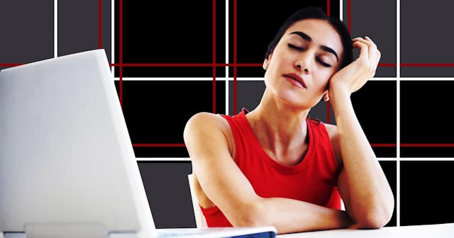 Stressed businesswoman sitting at laptop at desk