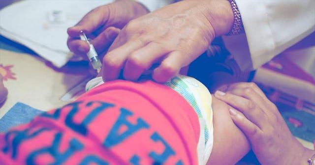 A vaccination of a baby boy