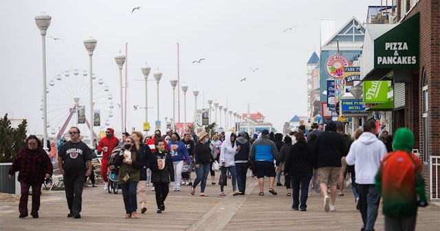 Crowds of people walk along the Ocean City Boardwalk during Memorial Day weekend on Sunday, May 24, ...