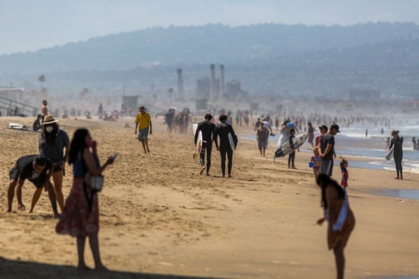 People visit one of Los Angeles Countys recently reopened beaches during the coronavirus pandemic, i...