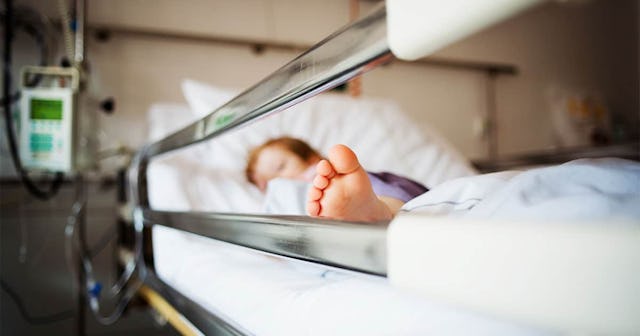 Children Are Being Hospitalized With Mysterious Inflammatory Syndrome: Young girl is lying in a hosp...