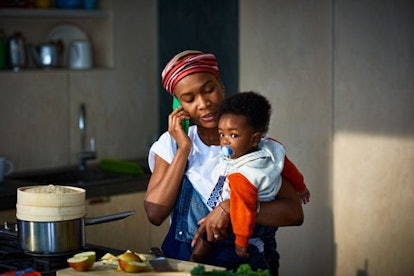 Woman with baby son in kitchen