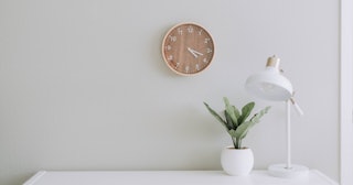 clean desk with clock and plant