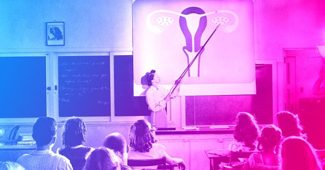 A teacher points to a diagram of female reproductive organs projected on a screen in a classroom in ...