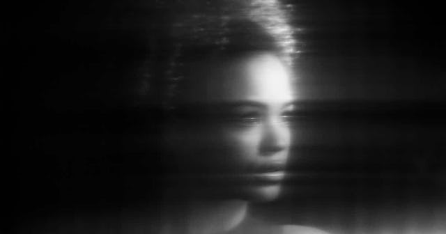 Distorted portrait of female reflection