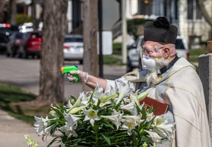 This Priest Is Going Viral For Shooting Holy Water With A Squirt Gun During Socially Distanced Servi...