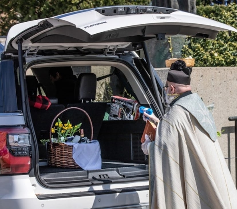 This Priest Is Going Viral For Shooting Holy Water With A Squirt Gun During Socially Distanced Servi...