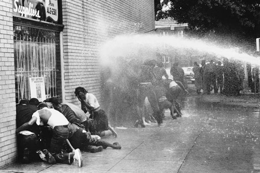 African American children are attacked by dogs and water cannons during a protest against segregatio...
