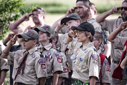 Boy Scouts salute during an America flag ceremony at their camp in Colorado.