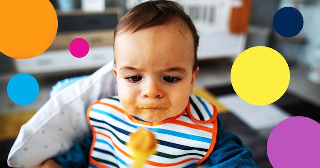 Angry baby looking at the spoon with food