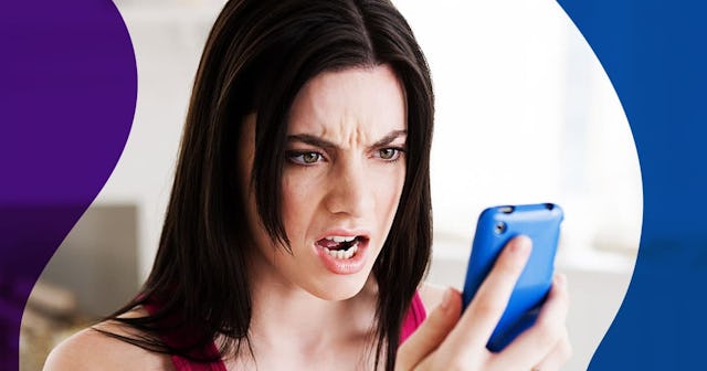 Angry woman looking at cellphone