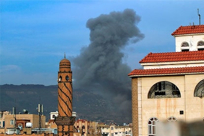 Smoke billows following an airstrike by Saudi-led coalition in the Yemeni capital Sanaa, on June 16,...