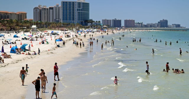 People visit Clearwater Beach after Governor Ron DeSantis opened the beaches at 7am on May 04, 2020 ...